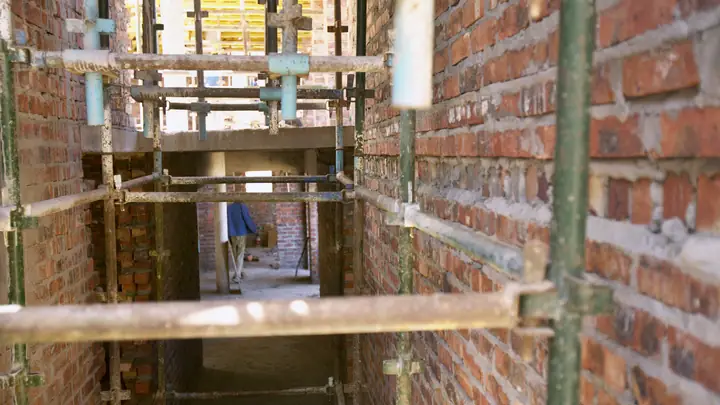 Scaffolding between two brick walls on a building site